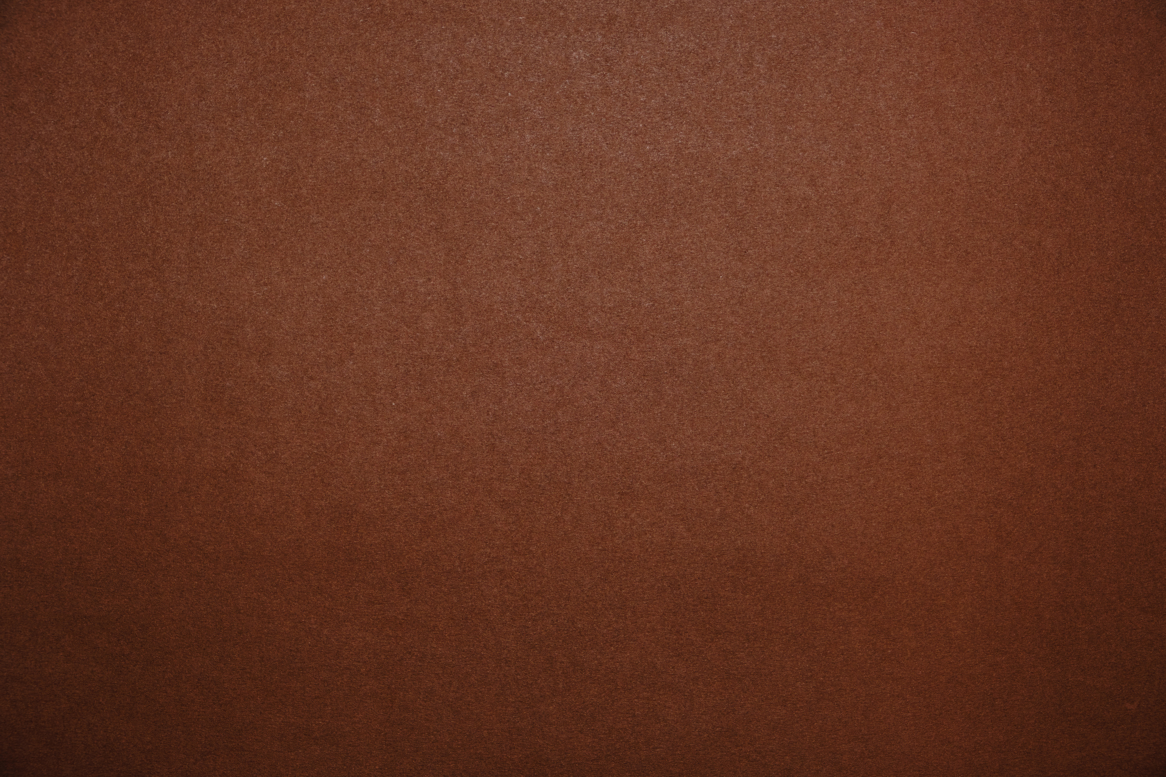 Bright brown background.Brown cardboard texture.